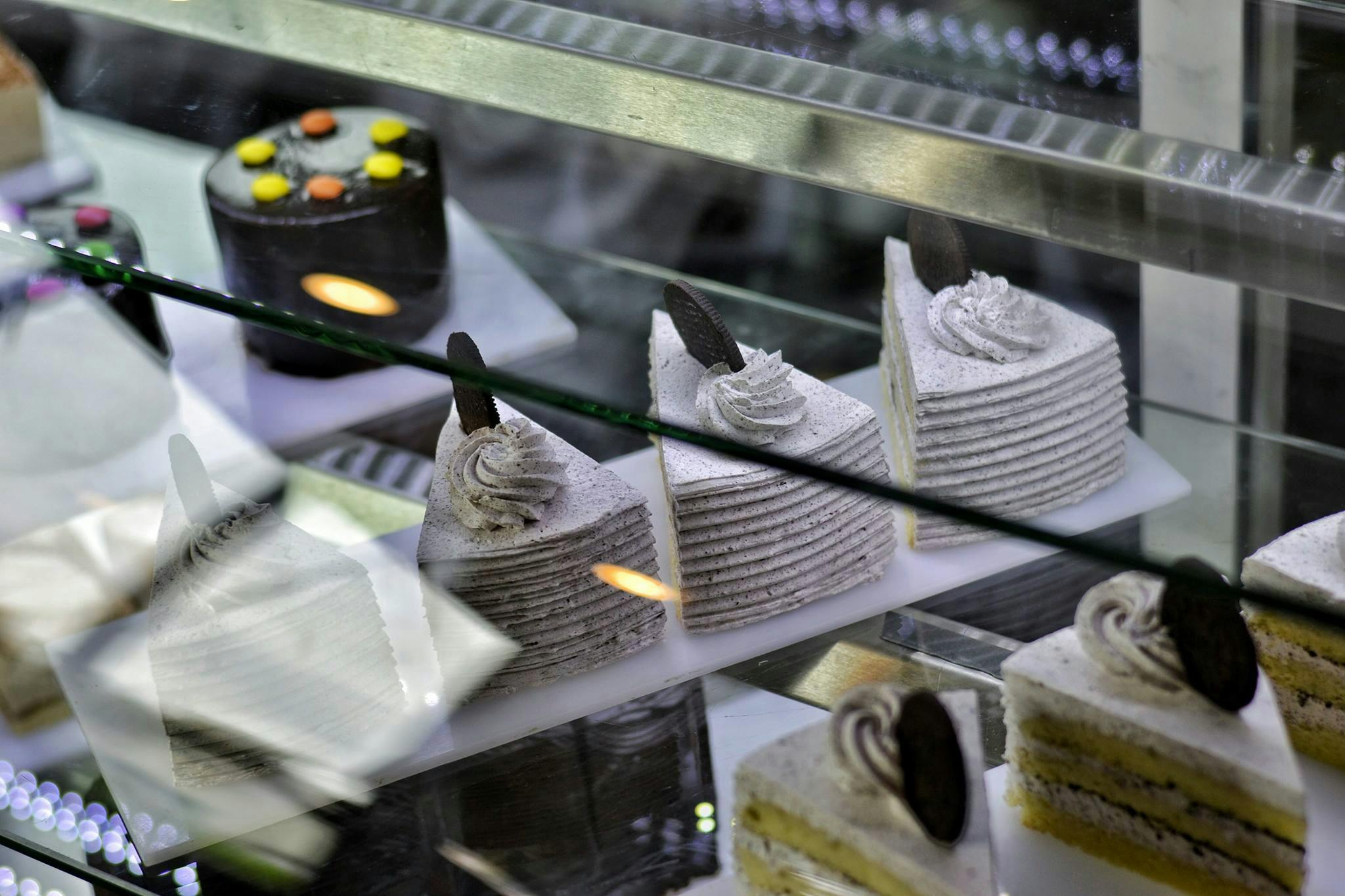Celebration cakes and bakery products arranged in a premium display